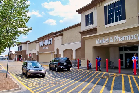 A Walmart Supercenter storefront with grocery and pharmacy entrances